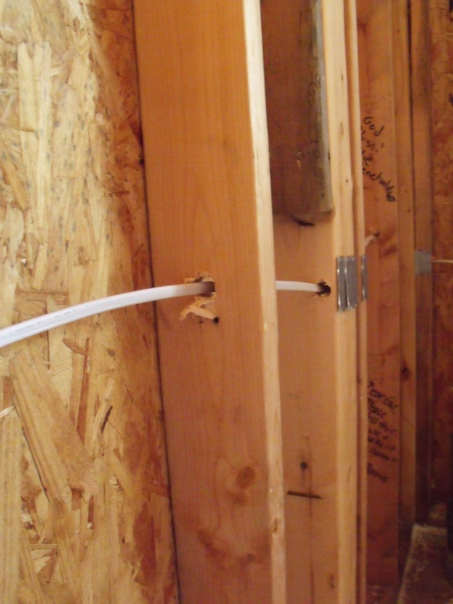 Low-voltage cable run through wood studs during rough-in